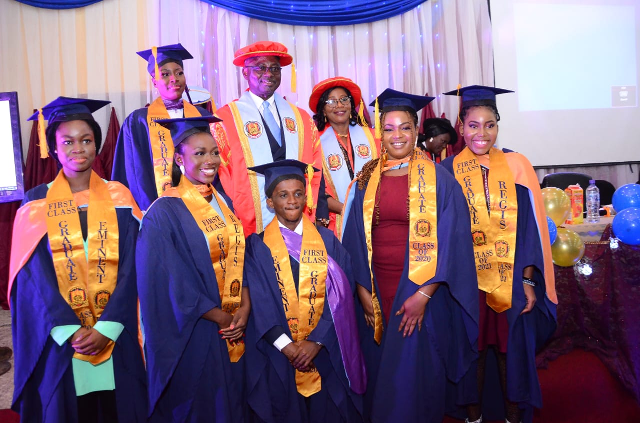 Some of the First Class graduates with the Chancellor and the VC