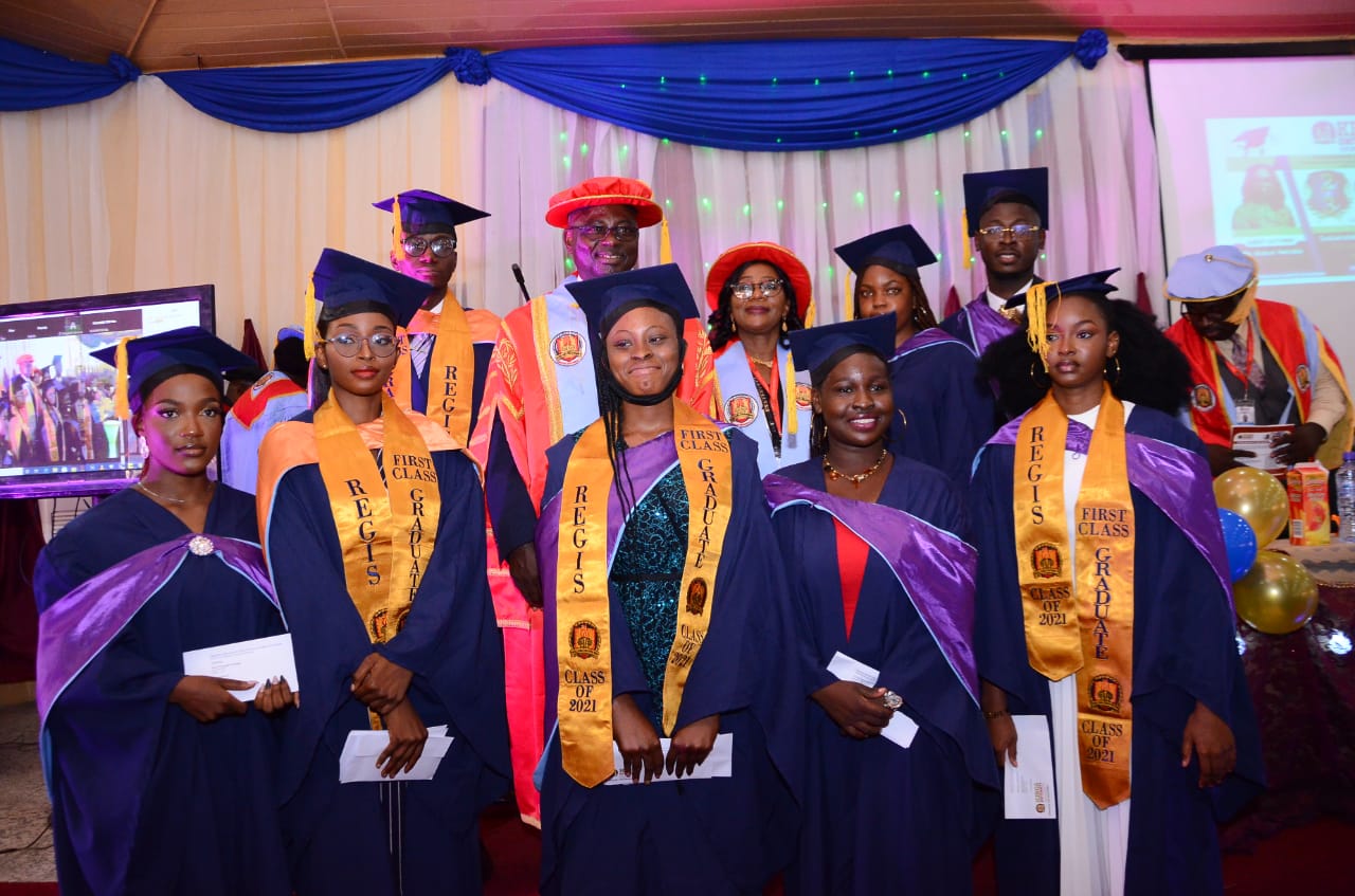 Some of the First Class graduates with the Chancellor and the VC